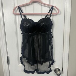 Black sequined lingerie top with side bow details and black ruffle trim. Large
